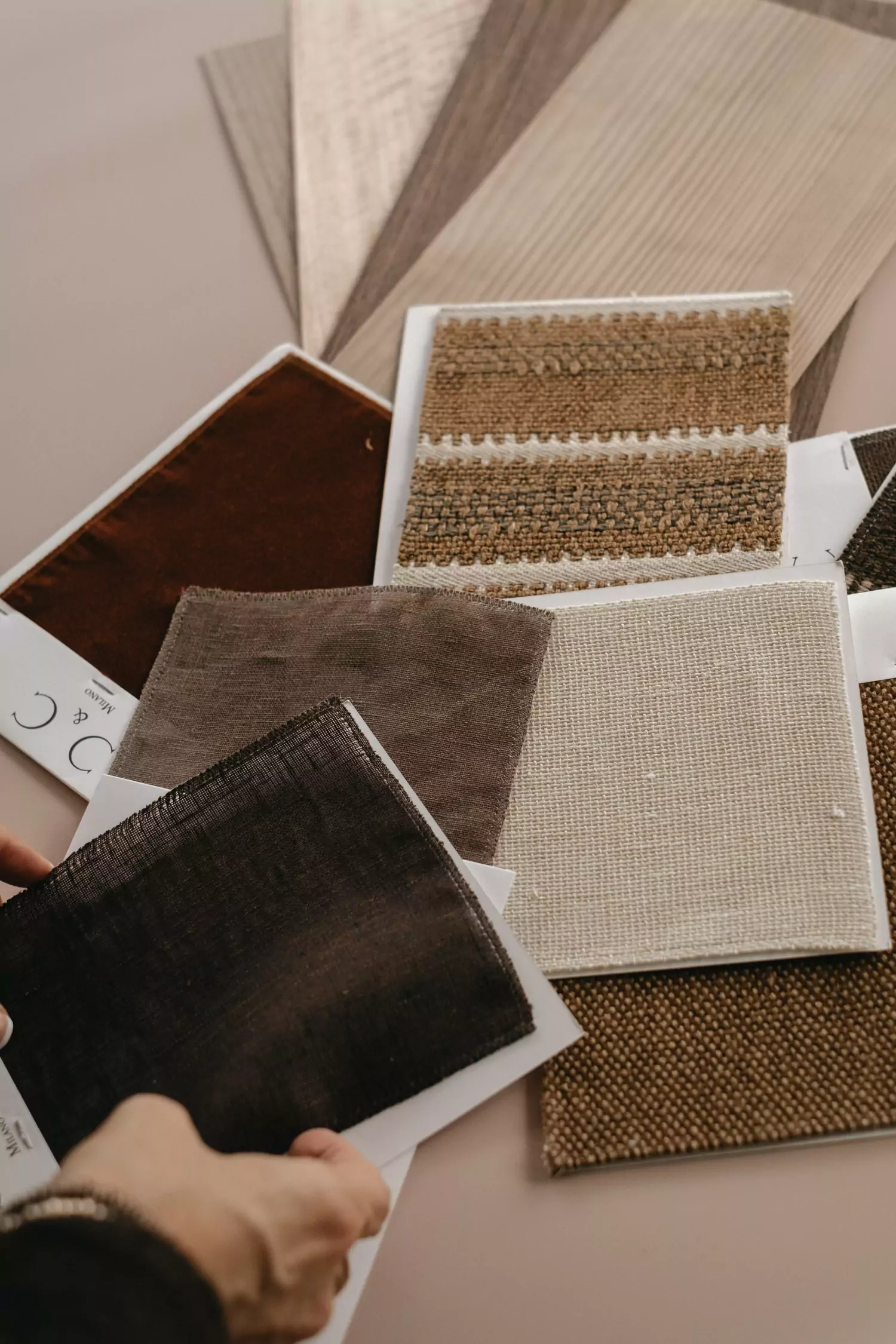 Interior designer Stefania Luraghi holds the fabrics sample selected for upholstery for a furniture project.